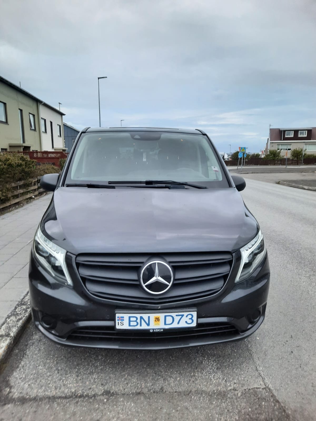 Black Mercedes-Benz Vito people carrier parked on an Icelandic street