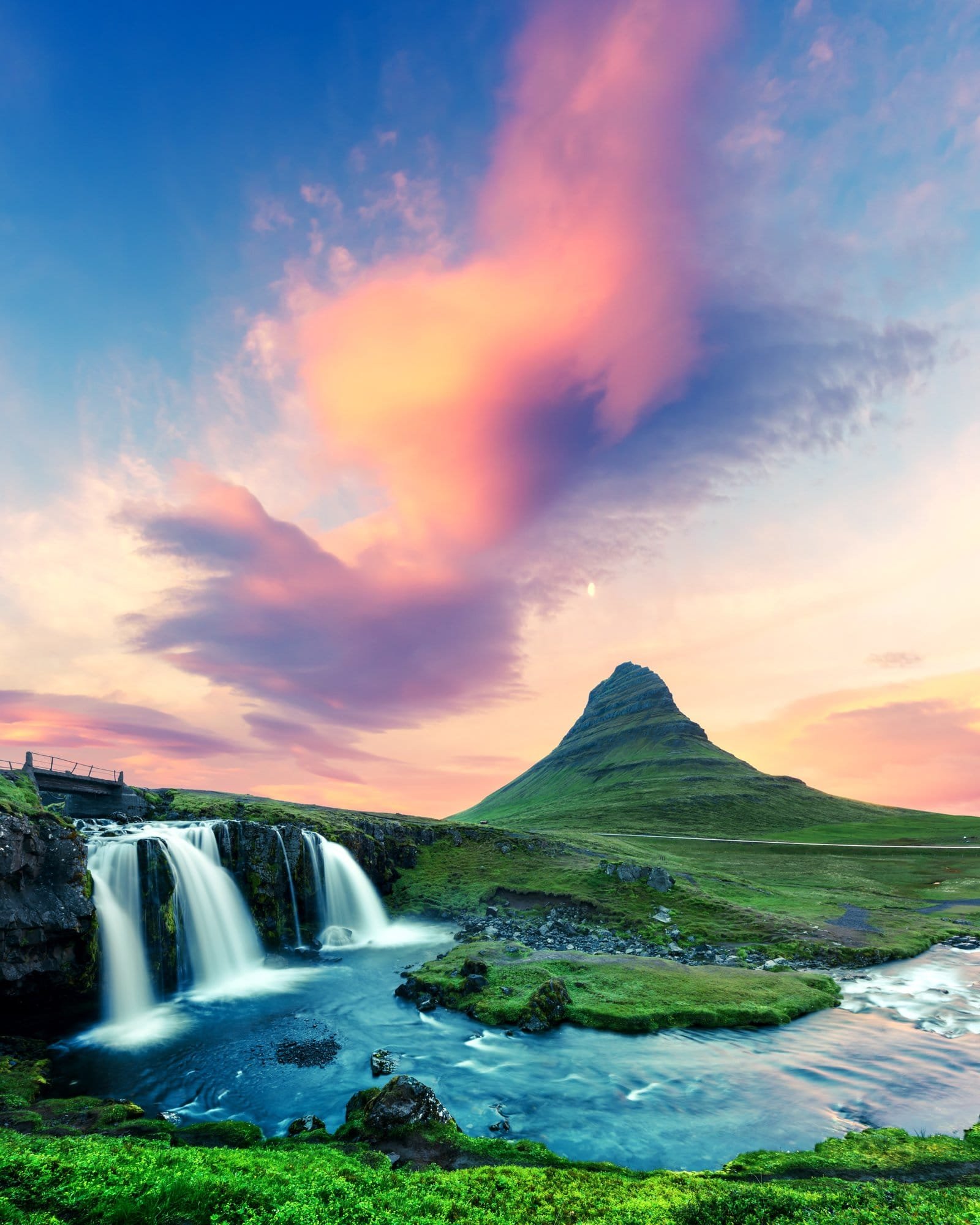 Kirkjufellsfoss waterfall at colorful sunrise