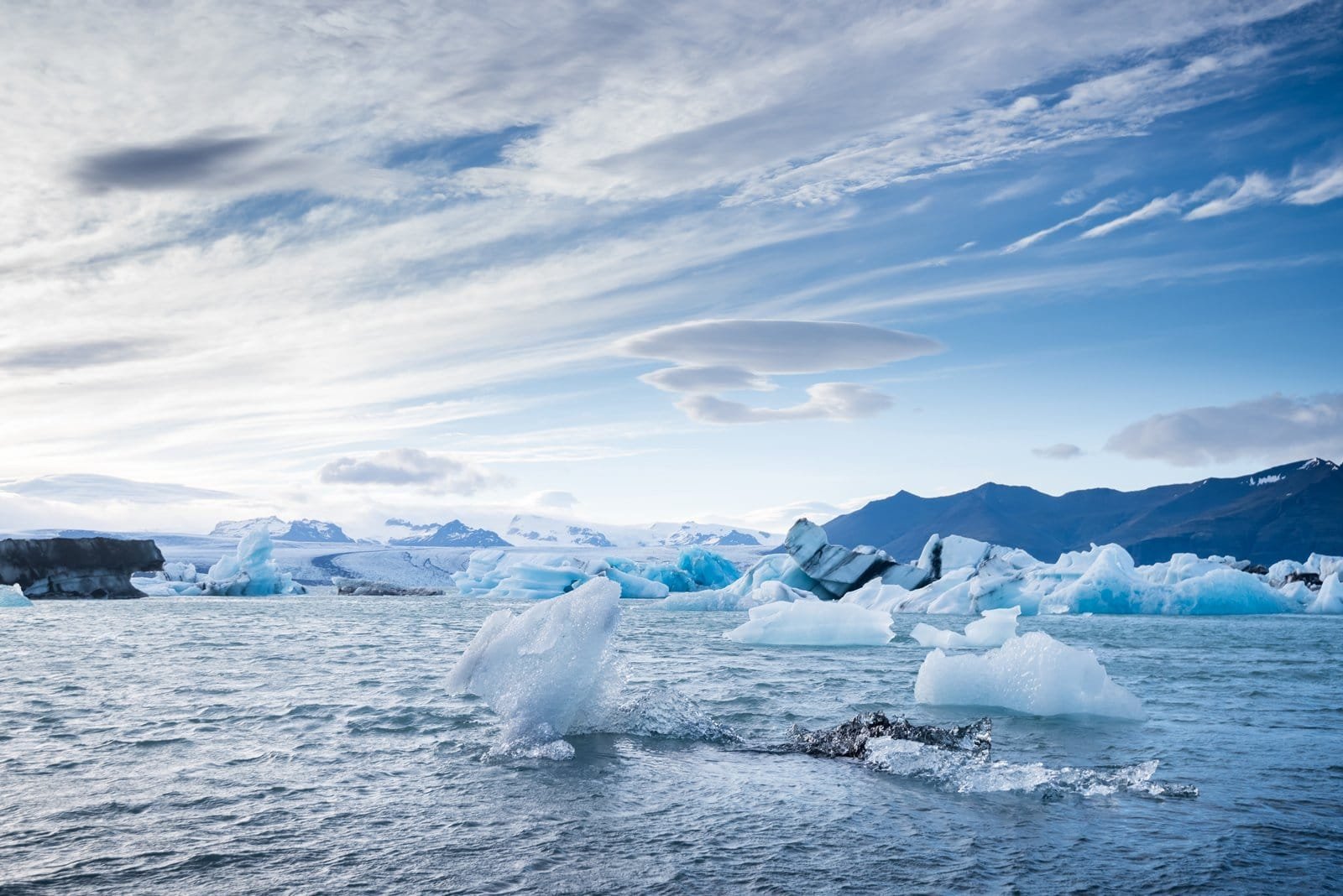 Blue icebergs drifting across Jökulsárlón glacier lagoon