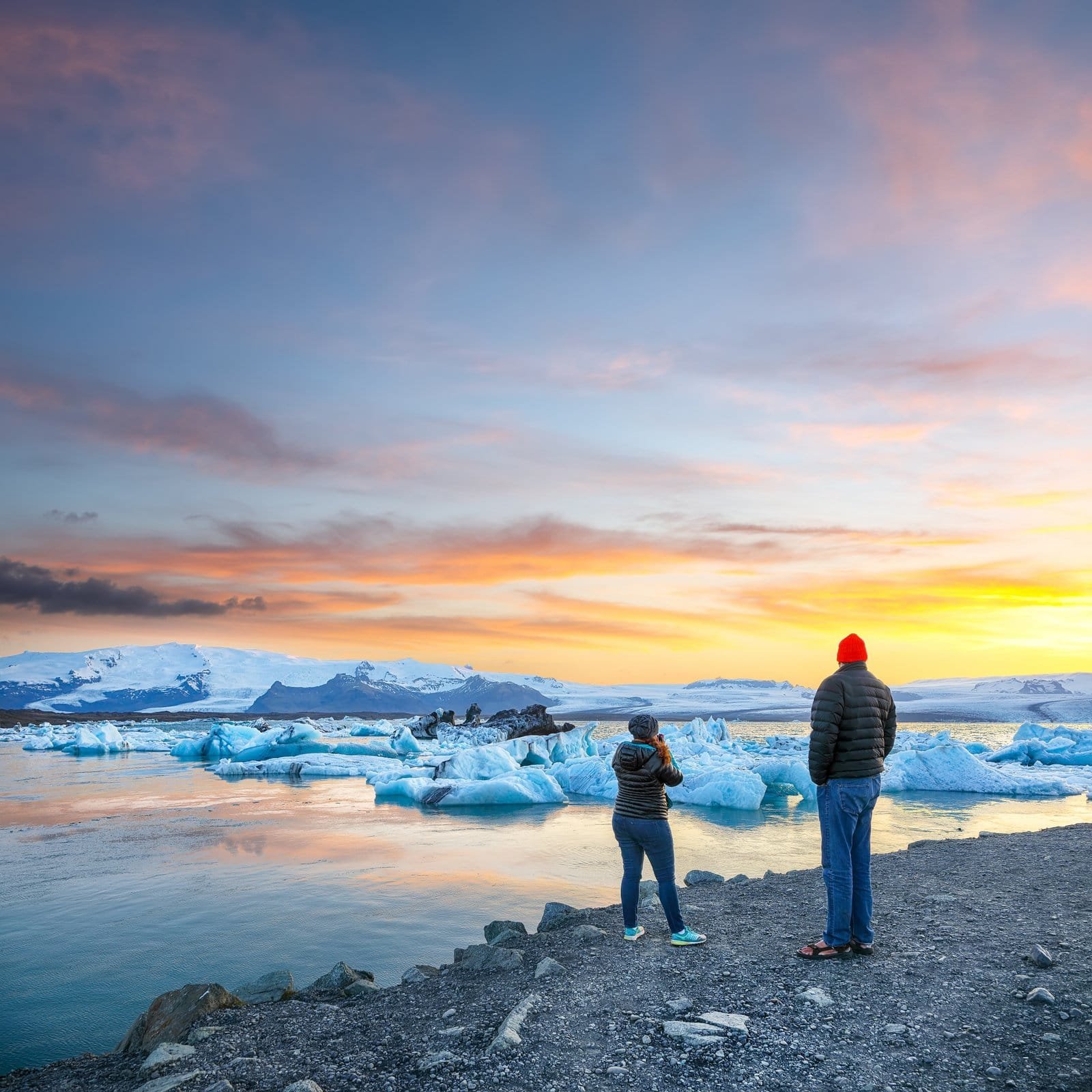 Floating icebergs mirrored in the still water of Jökulsárlón glacier lagoon